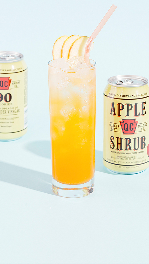 Carrot in the Core Cocktail and can of Quaker City Shrubs